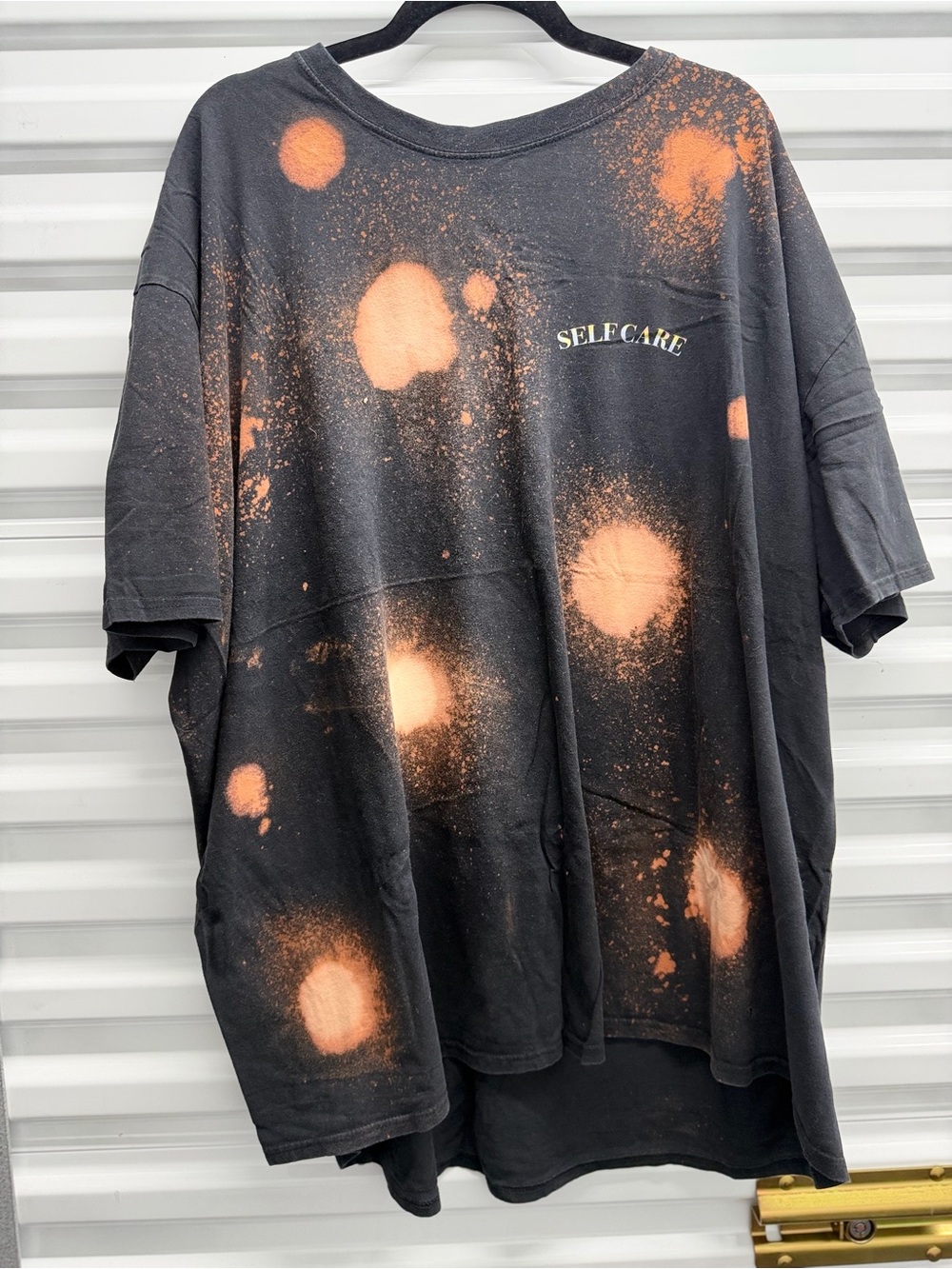 Selfcare Black Short-Sleeve Tee with Orange Bleach Splatter